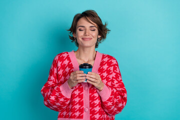Photo of dreamy cute lady wear pink cardigan drinking coffee enjoying aroma isolated teal color...