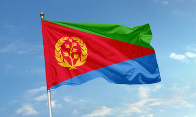 Eritrean national flag with olive wreath symbol waving in sky
