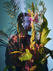 Pre-historical plants in bouquet in woman’s hands with double exposure effect