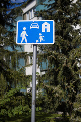 Residential Zone Traffic Sign with Pedestrian, Child, and Car Symbols..