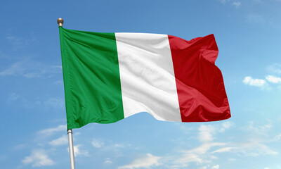 Italian national flag waving in blue sky