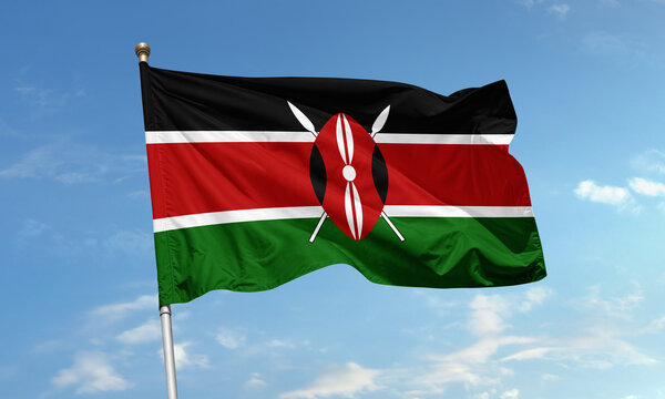 Kenyan flag waving in clear blue sky