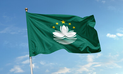 Macau regional flag with lotus flower and stars waving in daylight sky