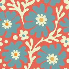 Playful floral seamless pattern with big flowers and leaves on a coral background