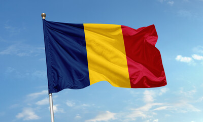 Romanian national flag flying under blue sky