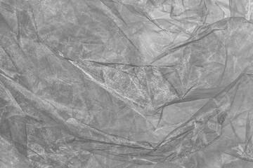Black and white crumpled organza fabric texture background.