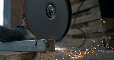 Close-up of hammer driving nail into wood in slow motion, precise and focused carpentry work, detailed view of hand holding plank and securing with nail