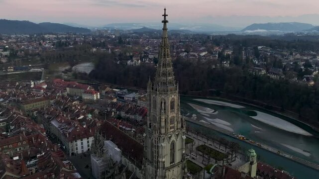 Illuminated City of Bern in Switzerland from above in Night Twilight - the Capital city Evening view. Aerial Drone shot.