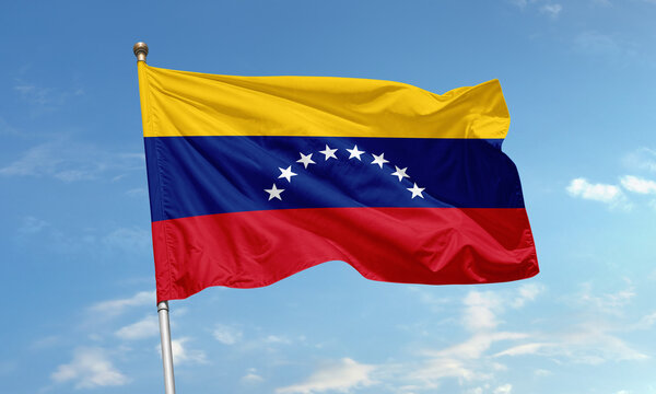 Venezuelan flag with stars waving in sky
