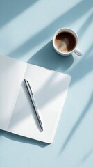 Writing in a Notebook With a Cup of Coffee on a Light Blue Table