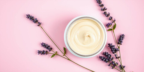 Plakat Top View of Lip Balm Jar with Lavender and Rosemary on Pink Background