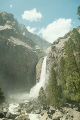Yosemite National Park in California’s Sierra Nevada mountains aesthetic greenery landscape scenery on sunny day granite cliffs and waterfall