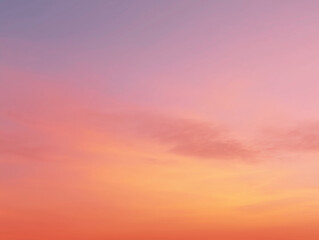 Obraz premium A gradient sky transitioning from sunset orange to soft pink, creating a serene atmosphere for travel or nature themes