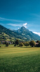 Fototapeta premium Breathtaking Mountain Landscape With Green Fields on a Clear Sunny Day in Switzerland