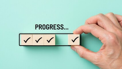 Checklist and task progress tracking concept. A hand placing the final checkmark on wooden blocks in a progress bar, task completion, productivity, goal setting, and efficient project management.