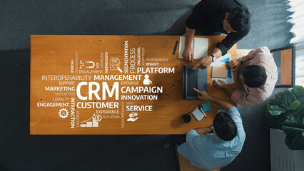 Explore a dynamic workspace where professionals collaborate on CRM strategies, enhancing customer...