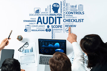 A professional team collaborates on an audit process, analyzing data and discussing review...