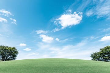 Serene Hilltop Landscape - Tranquil green hill under a bright blue sky, fluffy white clouds, peaceful nature scene, symbolizes serenity, freedom, growth, hope, and renewal
