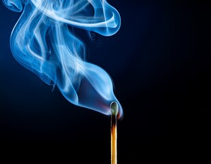 a matchstick is lit and the smoke is blue