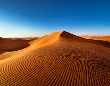 golden sand dunes rise majestically under a clear blue sky showcasing nature s stunning pattern and texture