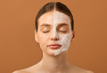 Organic cosmetic product. Lady applying mask on half of face, enjoying healthy pamper treatment and...