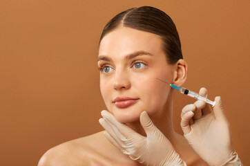 Aesthetic surgery and cosmetology concept. Beautiful European lady receiving beauty injection,...