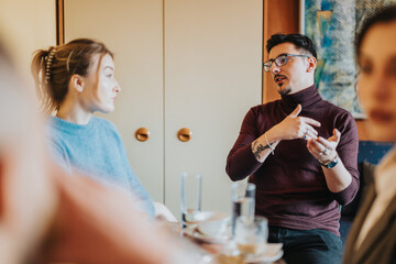 A group discusses ideas in a casual environment. Rich with expressions and diverse dynamics.