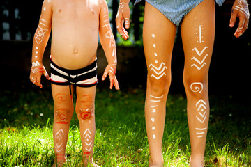 Two Painted Children as Indianans, Playing Outdoors on a Sunny Day – Screen-Free Childhood