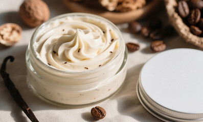 Whipped Body Butter in Glass Jar with Coffee Beans, Vanilla Pod and Nuts on Neutral Fabric Background