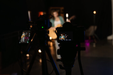 Live Acoustic Performance in a Studio with Neon Lights