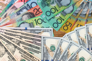 Australian dollars and US dollars on the table .