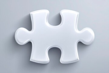 Obraz premium Glossy White Puzzle Piece on Gray Background Perfect for Concepts of Solutions Unity and Com