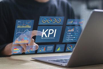 KPI, business performance indicators. Businessman working with data management system on computer...