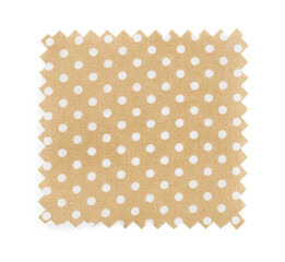 Sample of beige fabric with polka dot pattern isolated on white, top view