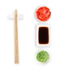 Set of sushi tablewear. Top view on saucer with soy sauce, small white bowls for ginger and wasabi and chopsticks at white background. Flat lay, copy space