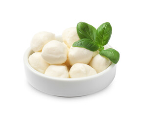 Tasty mozzarella cheese balls and basil in bowl isolated on white