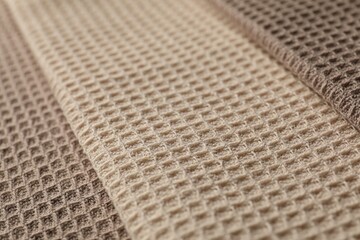 Different colorful waffle towels as background, closeup