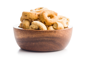 Salted crispy snack rings in bowl isolated on white background.