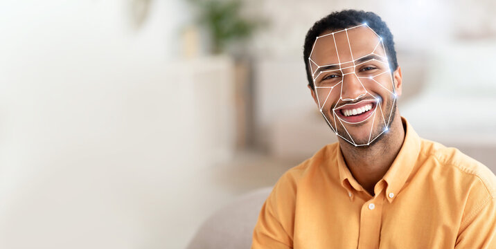 A smiling man with facial recognition technology applied, showcasing how modern systems check identification efficiently. This reflects the growing trend of tech use in daily activities.