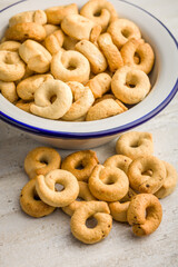 Salted crispy snack rings on kitchen table.