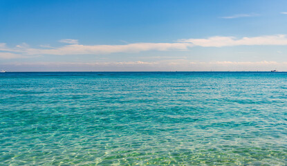 Aquamarine ocean nature. Background of clear turquoise sea water. Idyllic summer vacation. Mediterranean sea. Rippled surface. Ocean beach. Sea water surface. Ripple water of ocean