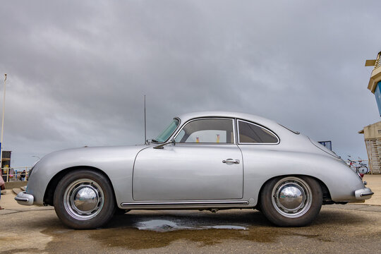 vintage Porsche 356 air-cooled sports car at outdoor car exhibition