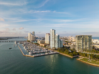 Fototapeta premium Marina dock. Luxury South beach marina. Miami south beach view. Docked luxurious yacht boat. Luxurious lifestyle. View of luxury Miami Florida. Summer vacation. Exclusive marina
