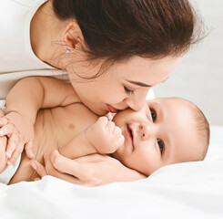 True love kiss. Adorable baby enjoying sweet tender mother touch
