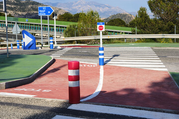 Roundabout with stop signs and directional arrows in alicante, road safety concept