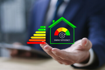 Energy efficiency concept, Energy efficient house building rate label audit. Businessman showing...
