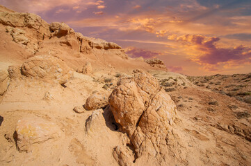 As the desert heat subsides, the Red Boguty Mountains come alive in mesmerizing shades of crimson,...