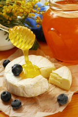 Tasty composition with cheese, honey and berries