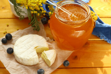 Tasty composition with cheese, honey and berries