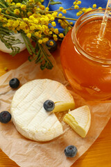 Tasty composition with cheese, honey and berries